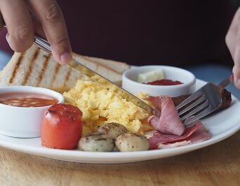 Breakfast Plate with Eggs Sausage and Toast at Assisted Living Facility Breakfast Plate with Eggs Sausage and Toast at Assisted Living Facility