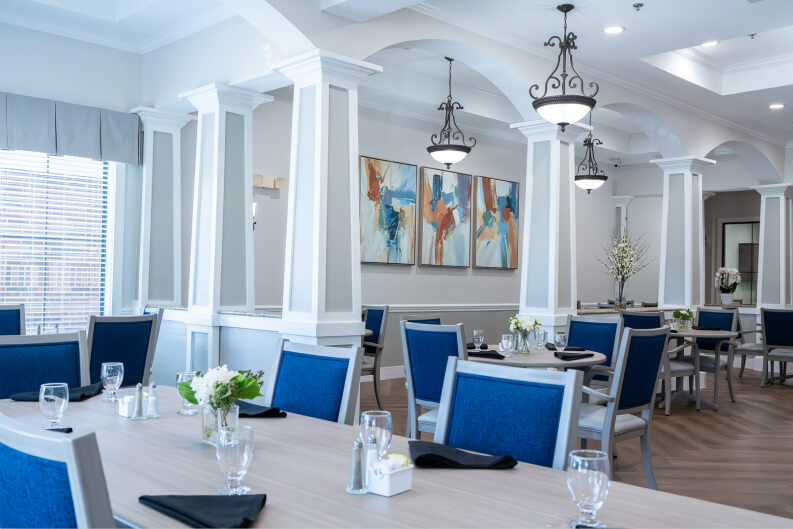 Formal Dining Room with Set Tables for Seniors at Assisted Living Facility Formal Dining Room with Set Tables for Seniors at Assisted Living Facility
