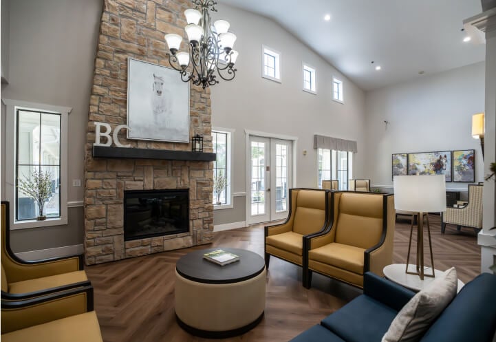 Vaulted Common Room with Stone Fireplace for Seniors at Assisted Living Facility Vaulted Common Room with Stone Fireplace for Seniors at Assisted Living Facility
