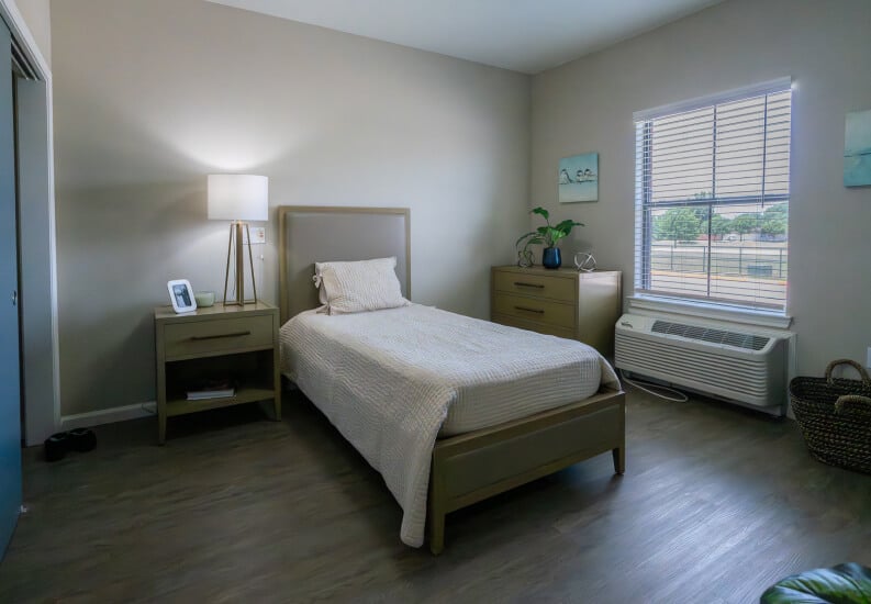 Private Bedroom with Natural Light for Seniors at Assisted Living Facility Private Bedroom with Natural Light for Seniors at Assisted Living Facility